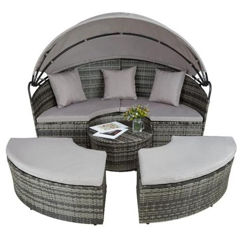 Ramoche's grey rattan day bed separated out into 4 pieces, including one sofa with canopy, a table and two large stools